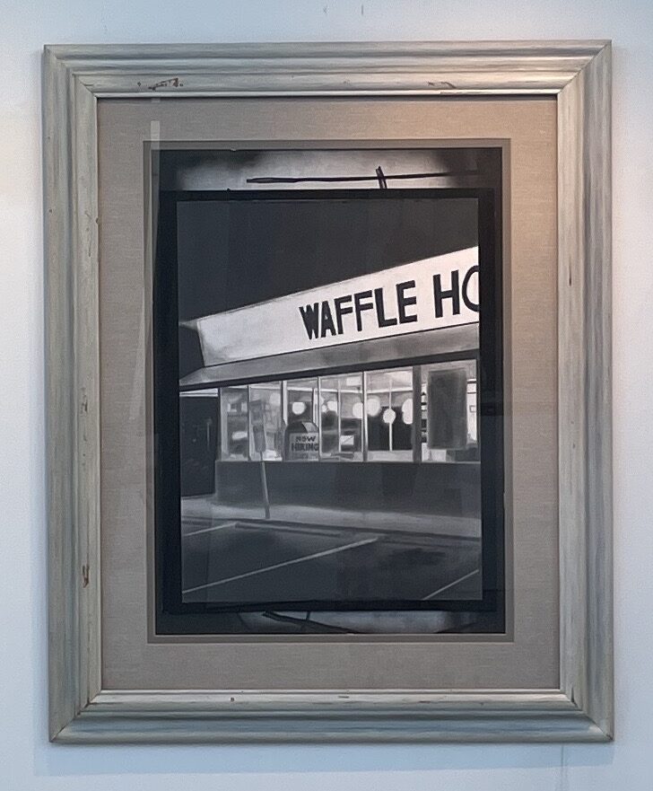 A photograph of a framed photo of a waffle house